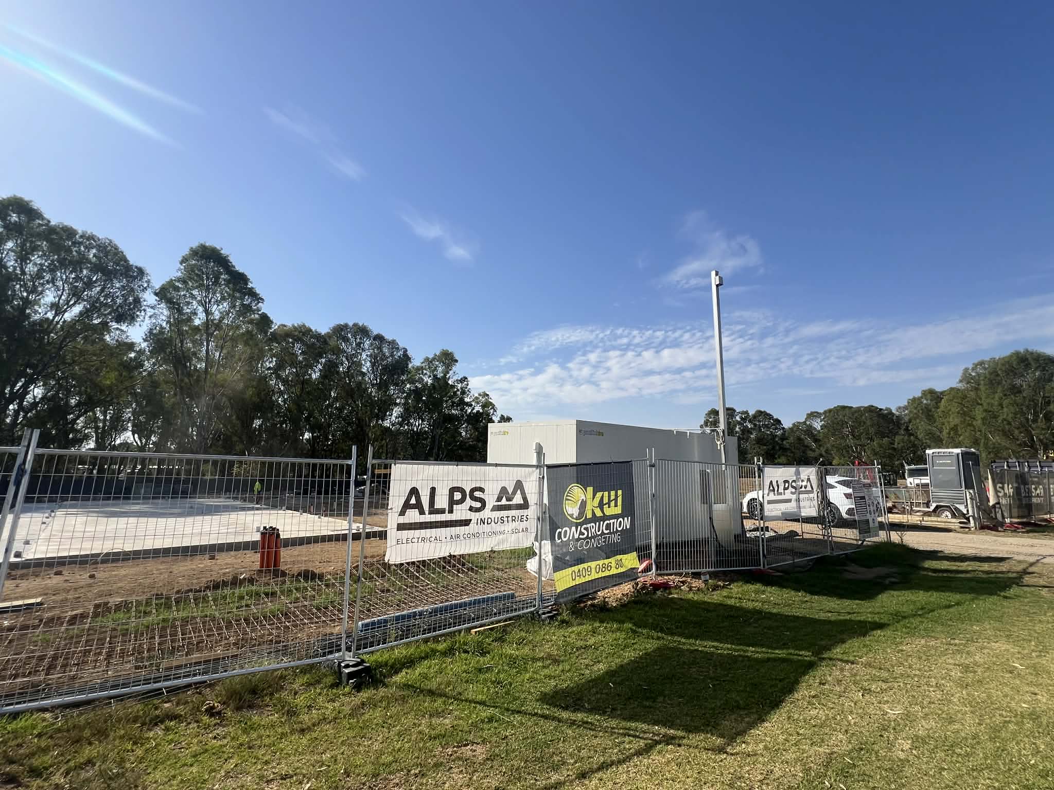 Alps Industries banners on a commercial job site